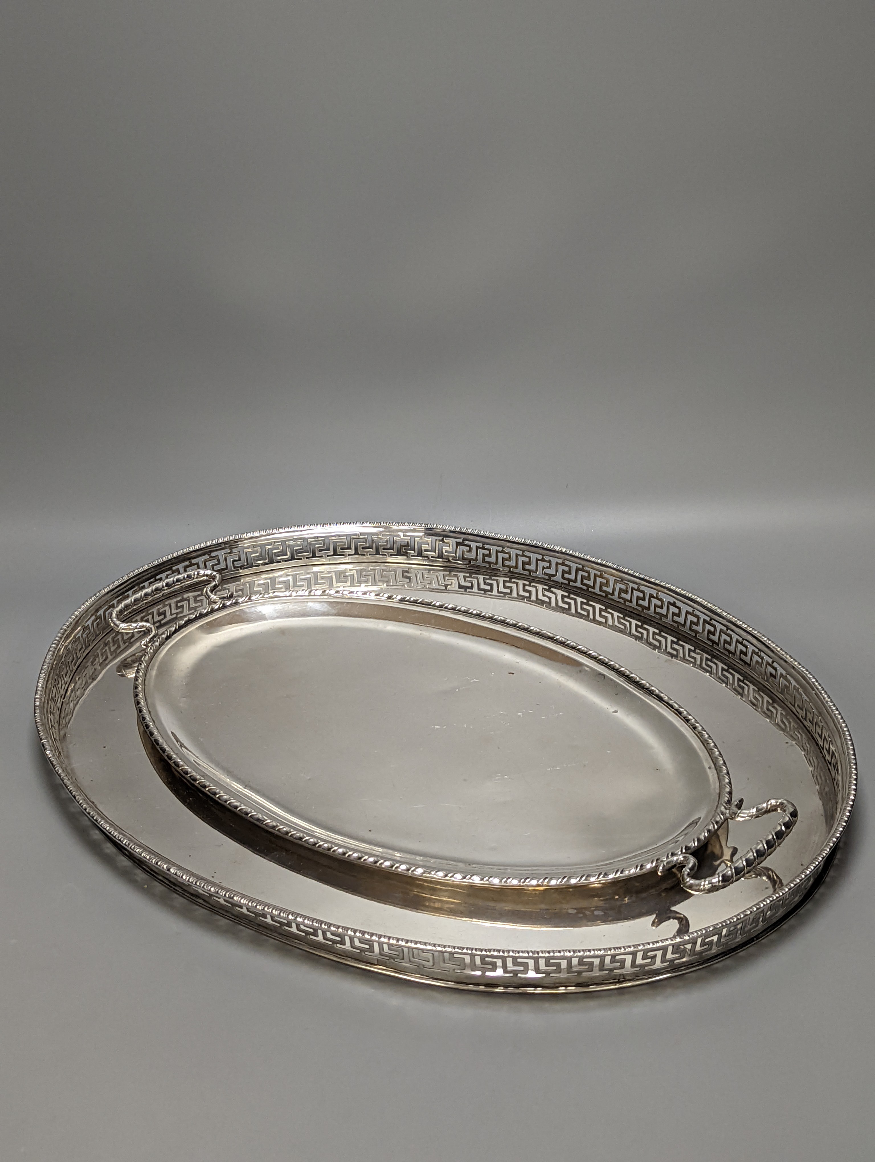 A Persian? white metal oval gallery tray, 45.7cm and an Italian 800 standard two handled oval tea tray